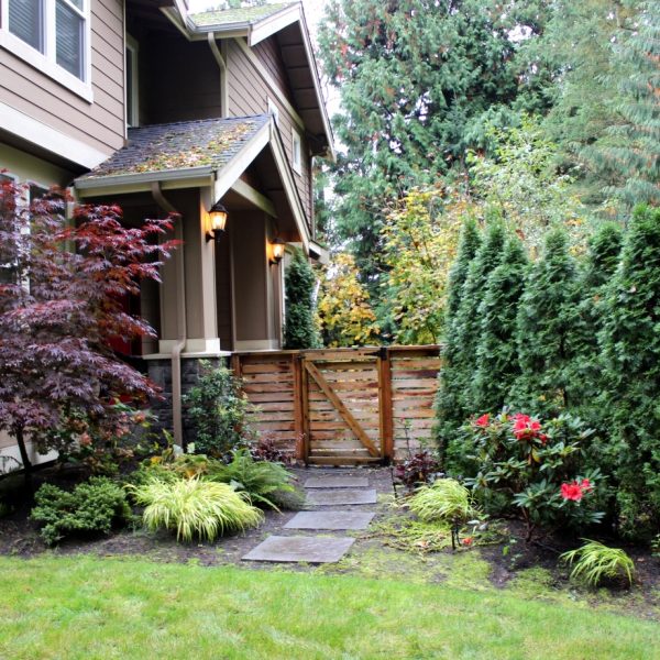 View from the hot tub is improved by moving the fence from corner of the house to the front entry pillars.